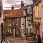 Narrow road lined with pubs in Robin Hood Bay