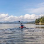 A paddler sets out in a kayak