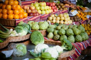 An array of fruits of vegetables at a market display