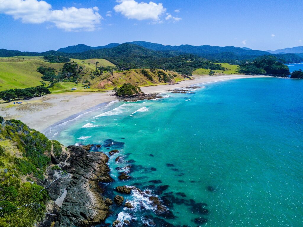 Aerial view of bright turquoise waters and sandy beach