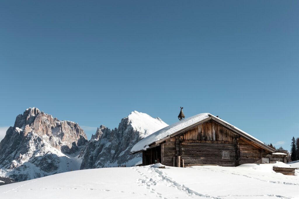 A cabin on a snow-covered peak