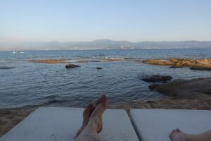 Photo of happy feet beach view in Corsica from a beach chair